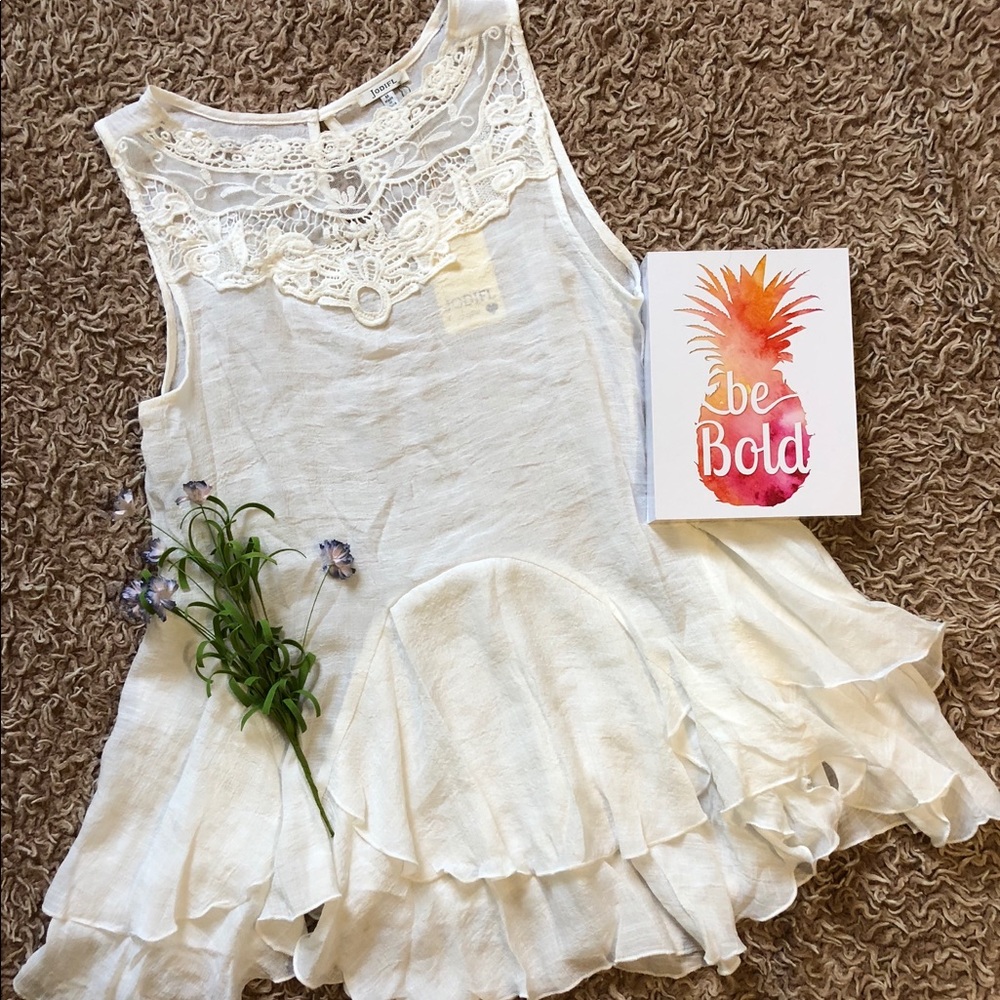 White ruffled blouse